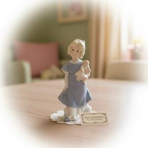 Rex Valencia porcelain girl with doll figurine